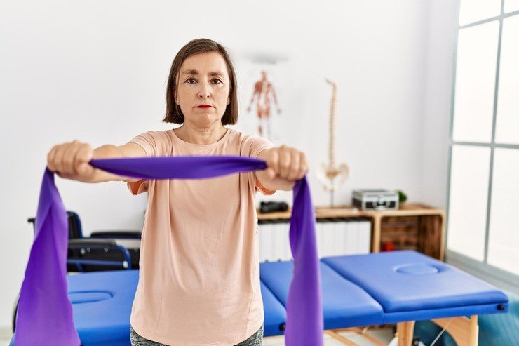 Patient exercising with a resistance band
