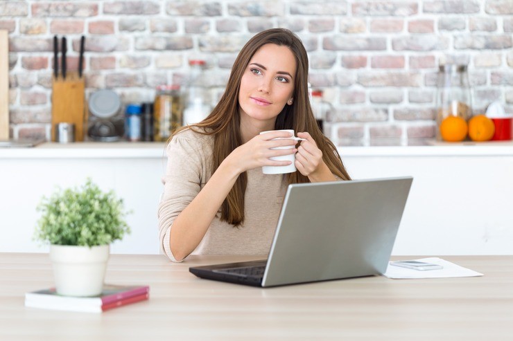 Woman reading health tips at home